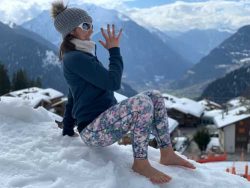Edita performs Crab position, barefoot in Swiss Alps