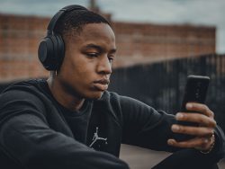 Young man listening to head phones