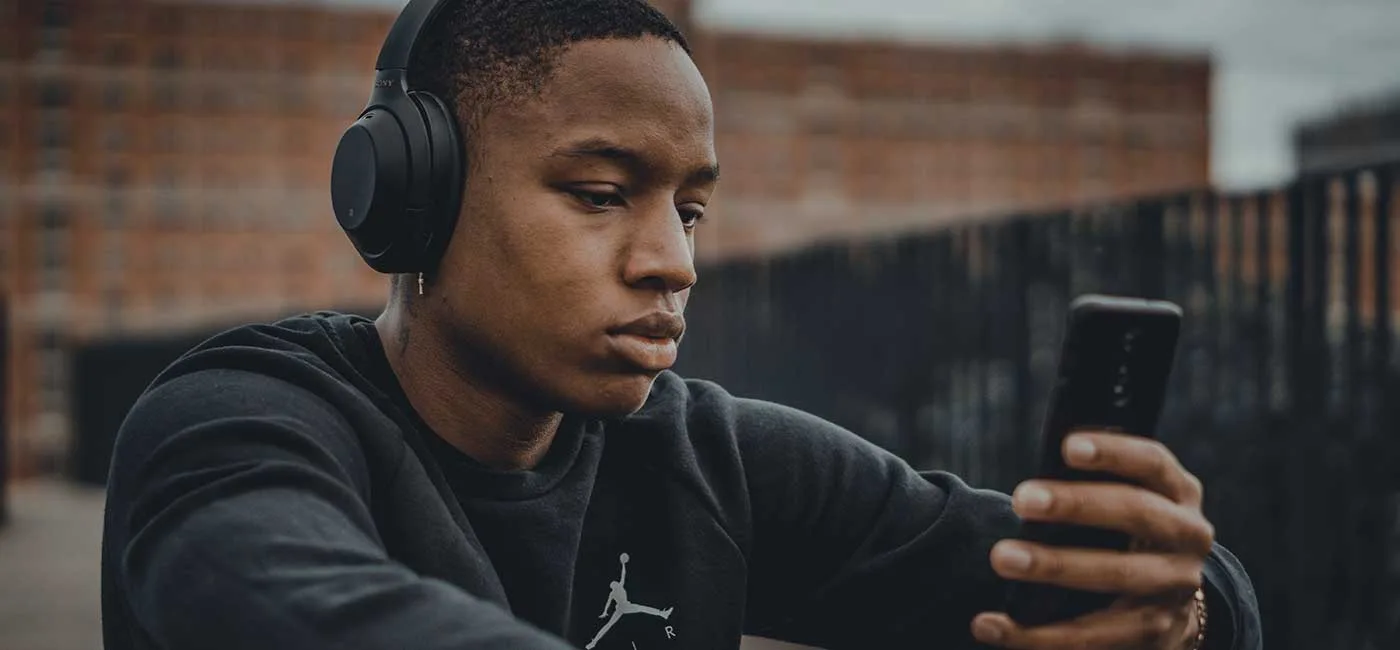 Young man listening to headphones