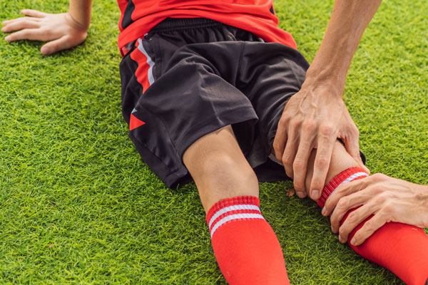 Injured soccer player receives assistance