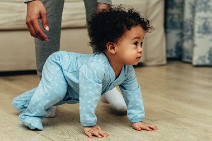 Baby crawls on hands and feet